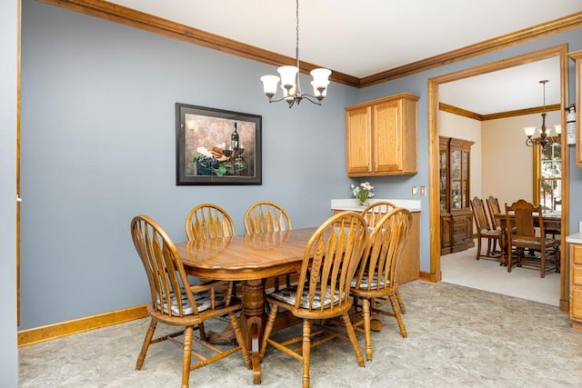 dining room featuring a chandelier, light carpet, crown molding, and baseboards