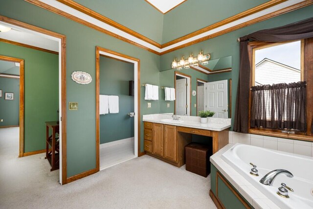 bathroom featuring carpet, crown molding, baseboards, a bath, and vanity