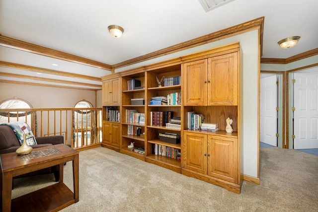 sitting room with visible vents, baseboards, ornamental molding, and carpet flooring