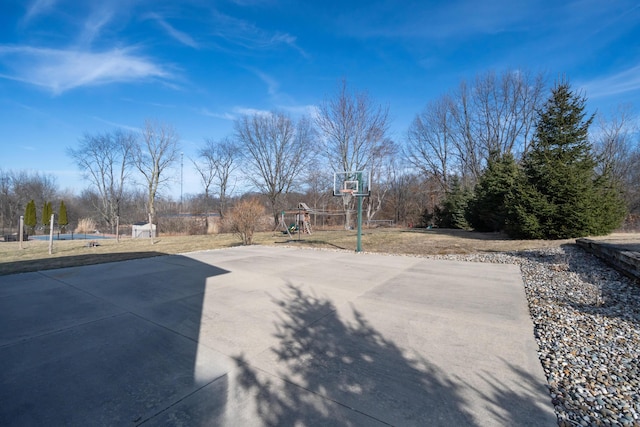 view of patio / terrace with playground community and community basketball court