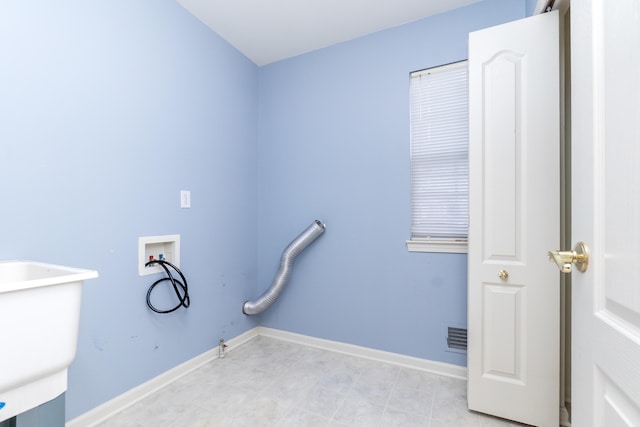 laundry room with washer hookup, a sink, baseboards, gas dryer hookup, and laundry area