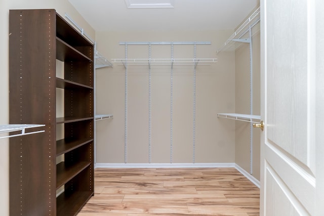 spacious closet with wood finished floors