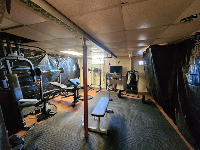 workout room featuring a drop ceiling