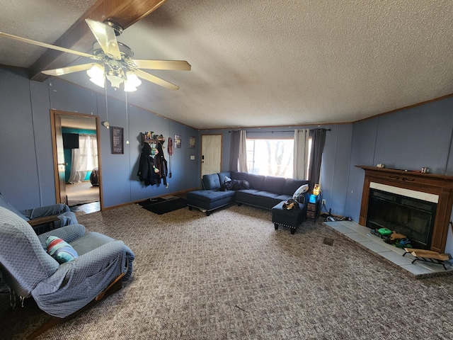 carpeted living area featuring a glass covered fireplace, lofted ceiling, ceiling fan, and a textured ceiling