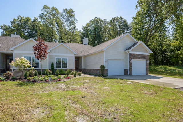 view of front of property featuring a shingled roof, a front lawn, driveway, stone siding, and an attached garage