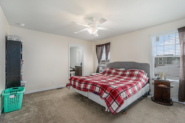 bedroom with carpet flooring, multiple windows, baseboards, and visible vents