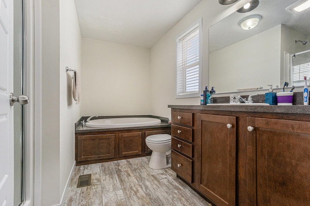 full bath with a bath, visible vents, plenty of natural light, and a shower with shower door