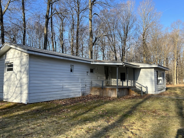 back of house with metal roof