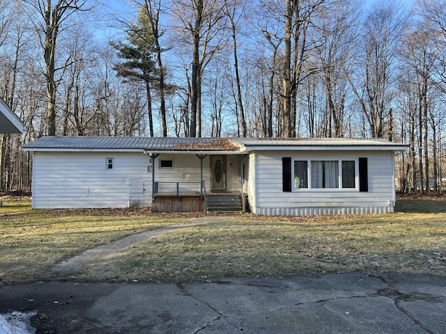 view of front of property featuring covered porch and metal roof