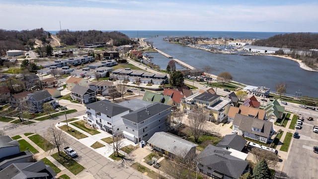 bird's eye view featuring a water view and a residential view