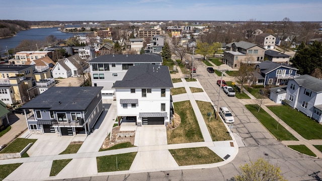 bird's eye view featuring a residential view and a water view