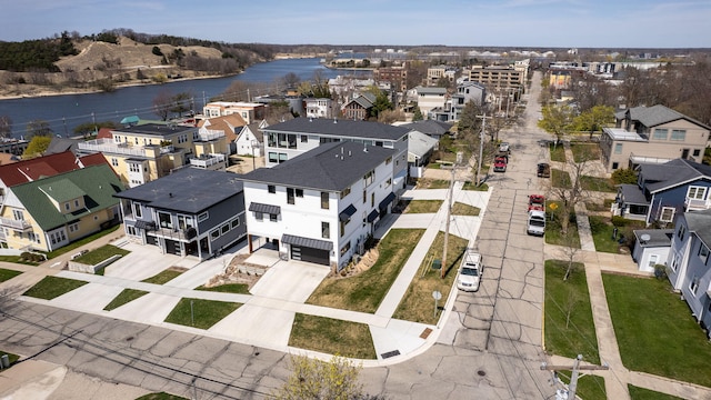 bird's eye view with a residential view and a water view