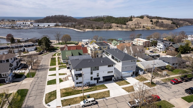 bird's eye view featuring a residential view and a water view