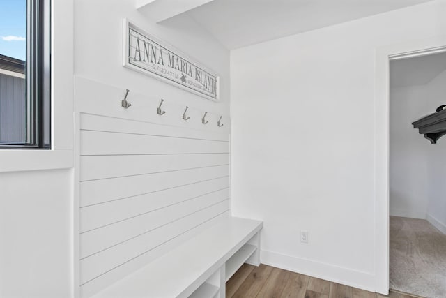 mudroom featuring wood finished floors and baseboards