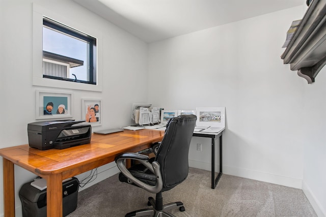 home office featuring baseboards and carpet