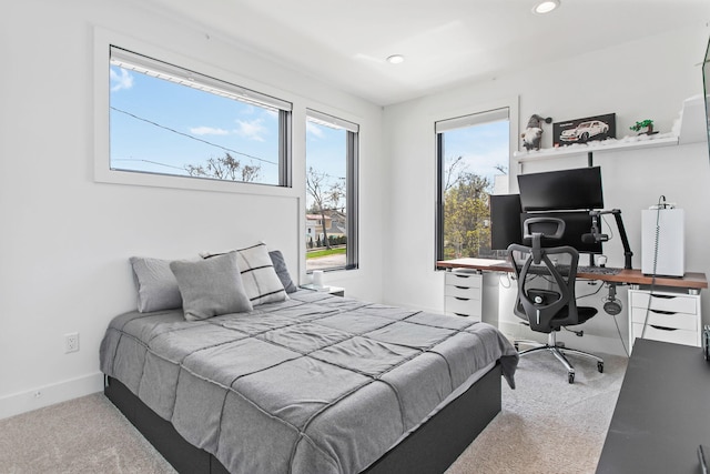 bedroom featuring recessed lighting, baseboards, and carpet