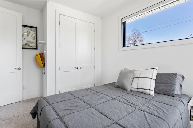 carpeted bedroom featuring a closet