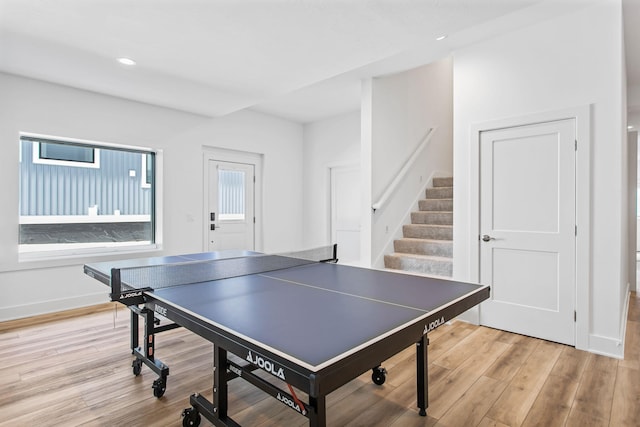 rec room featuring recessed lighting, baseboards, and light wood-type flooring