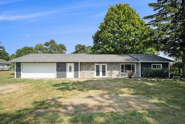 ranch-style home with french doors, stone siding, a front yard, and an attached garage