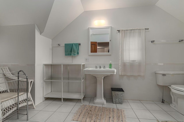 14598 Lakeshore Rd, Lakeside, MI 49116 - bathroom featuring tile patterned floors, lofted ceiling, toilet, and tile walls