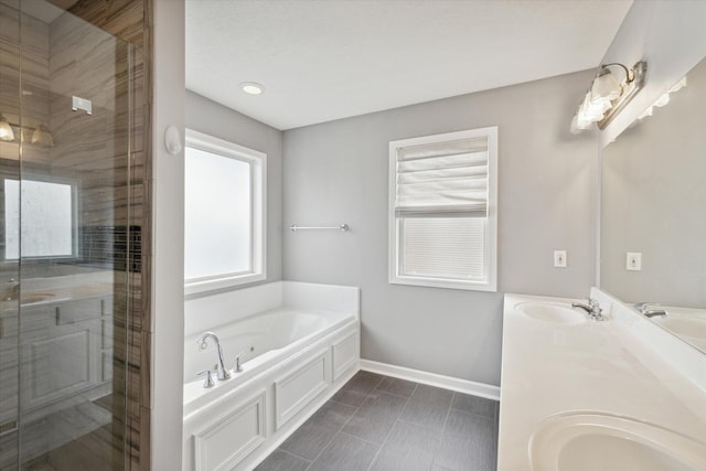 full bath with double vanity, a stall shower, a whirlpool tub, and a sink