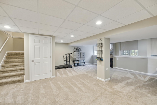 exercise area with recessed lighting, a paneled ceiling, baseboards, and carpet floors