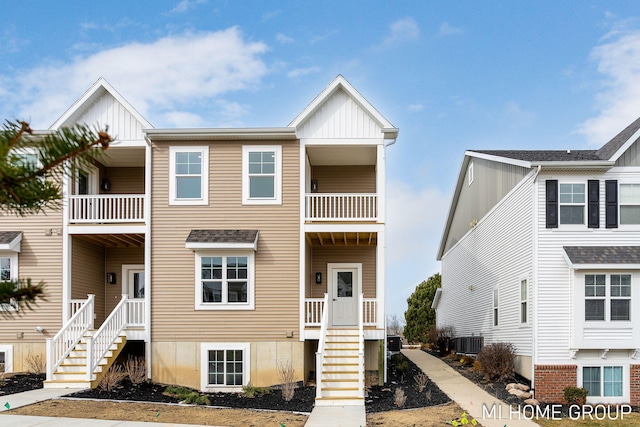 view of property featuring central AC unit and board and batten siding