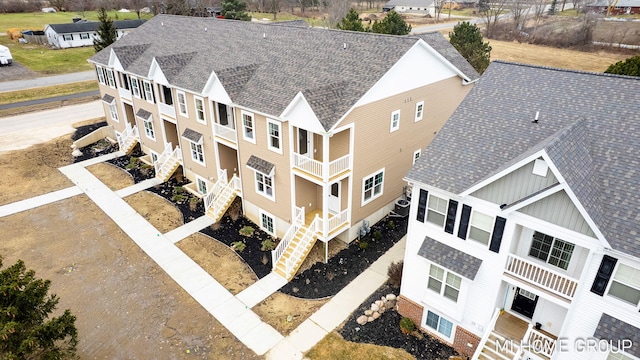 birds eye view of property with a residential view