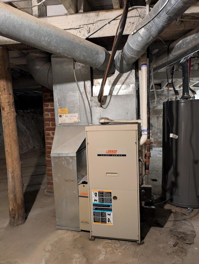 utility room featuring water heater