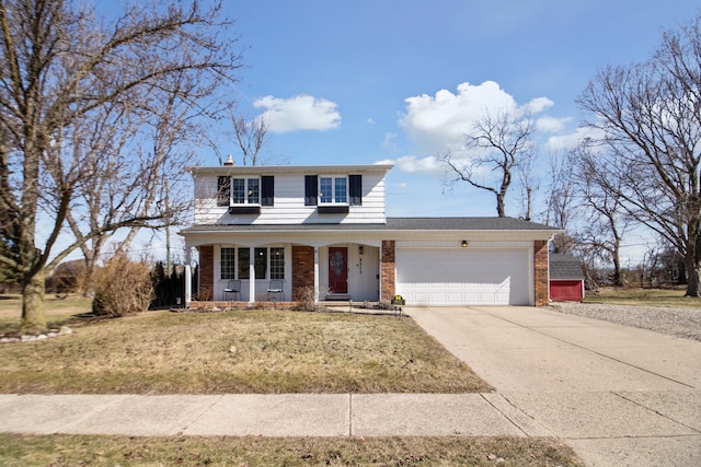 traditional-style home featuring a chimney, concrete driveway, a front lawn, a garage, and brick siding