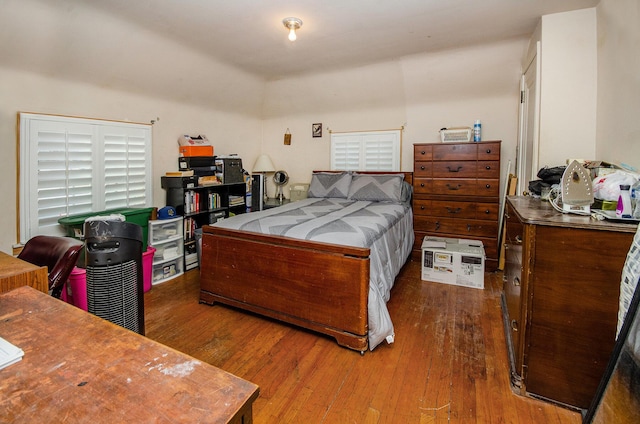 bedroom with wood-type flooring