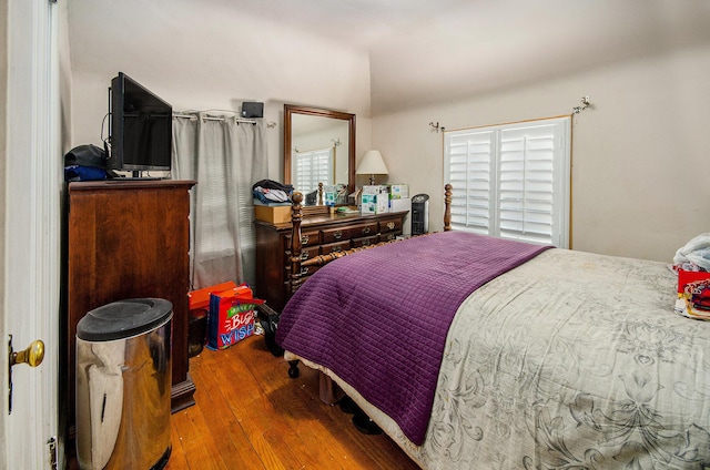 bedroom with wood-type flooring