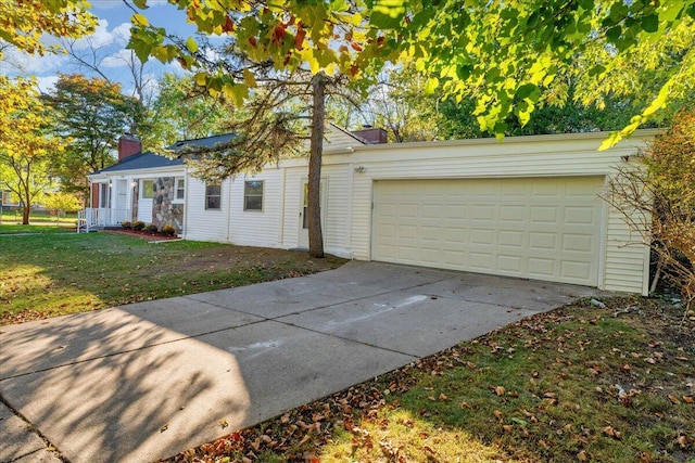 exterior space featuring concrete driveway