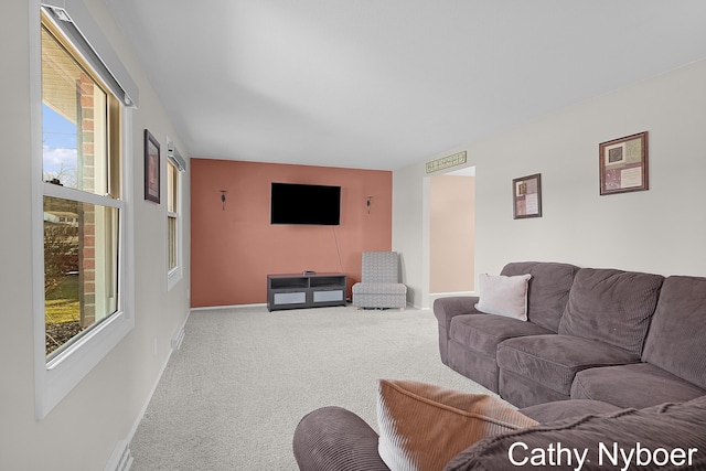 living room featuring baseboards and carpet floors