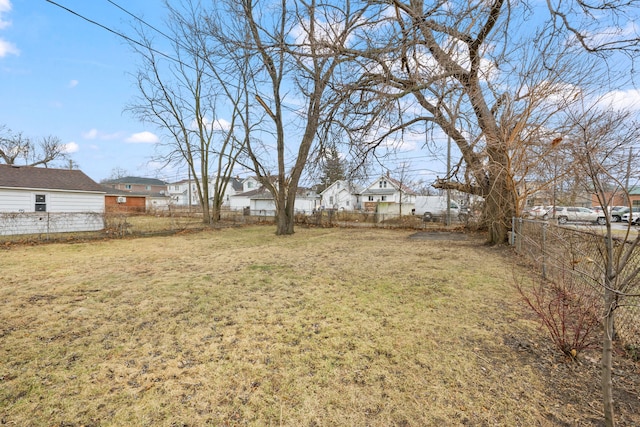 view of yard featuring a residential view and a fenced backyard