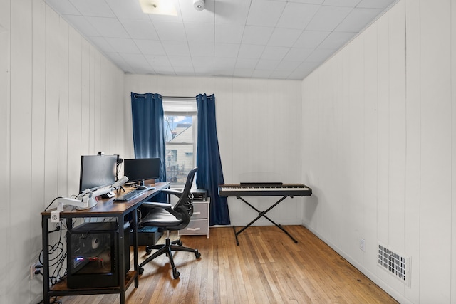 home office with visible vents and wood-type flooring