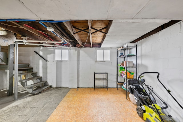 below grade area with tile patterned floors and stairway