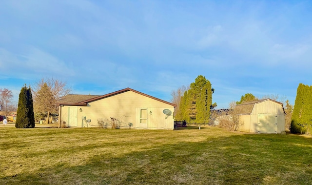 view of property exterior with a storage shed, an outbuilding, and a yard