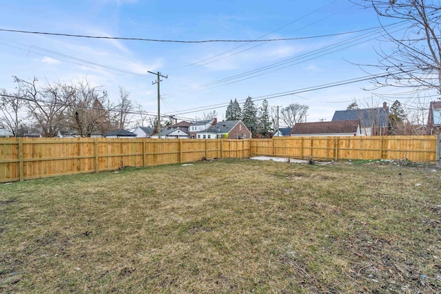 view of yard with a fenced backyard