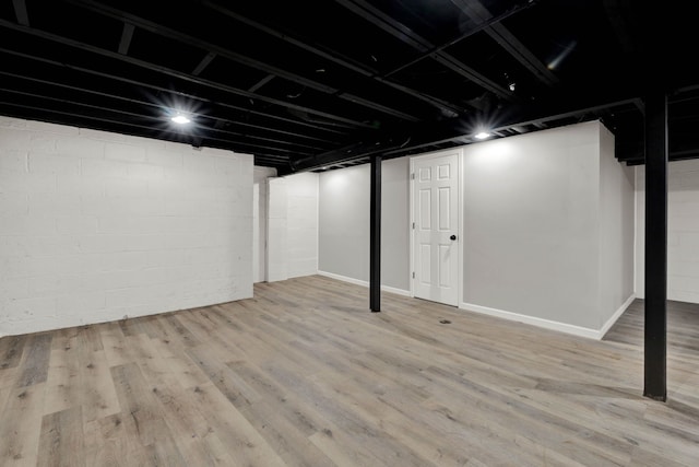 finished basement featuring wood finished floors