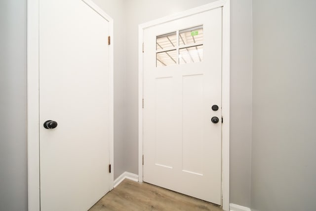 doorway to outside with light wood-type flooring