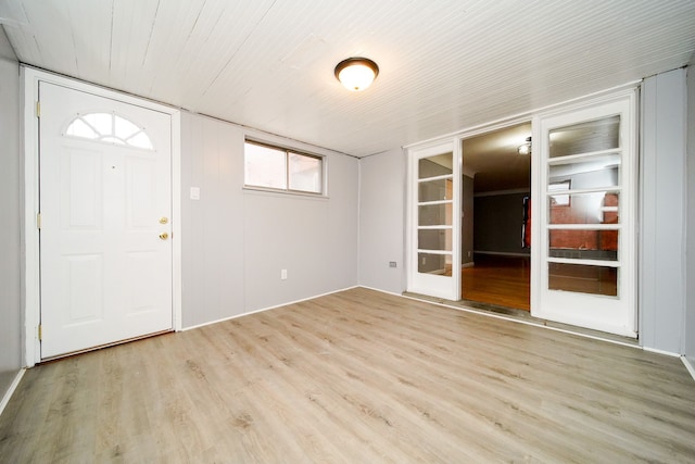 foyer entrance featuring wooden ceiling and light wood finished floors