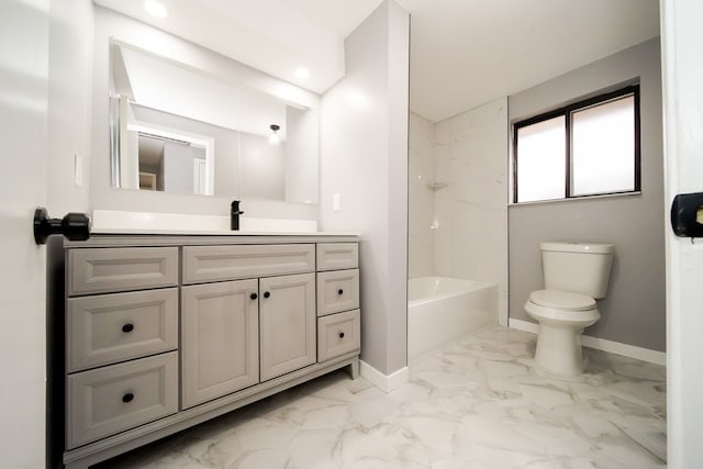 bathroom with baseboards, toilet, marble finish floor, and vanity