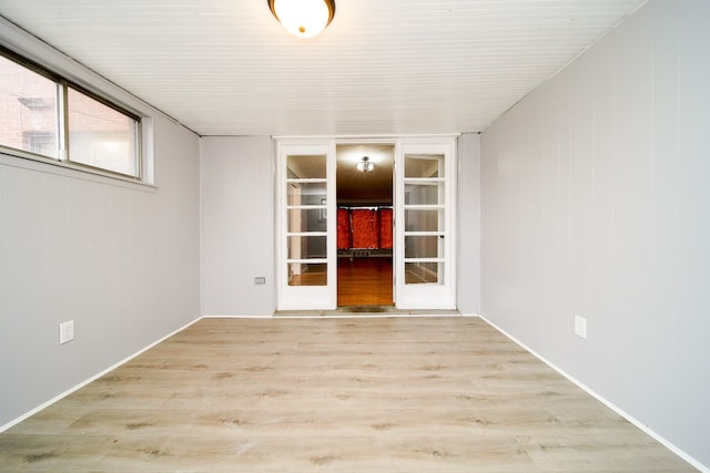 unfurnished room with wood finished floors