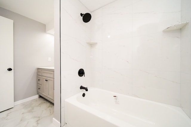 full bath with vanity, baseboards, marble finish floor, and shower / bath combination