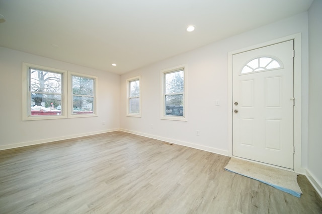 entryway featuring recessed lighting, baseboards, and light wood finished floors