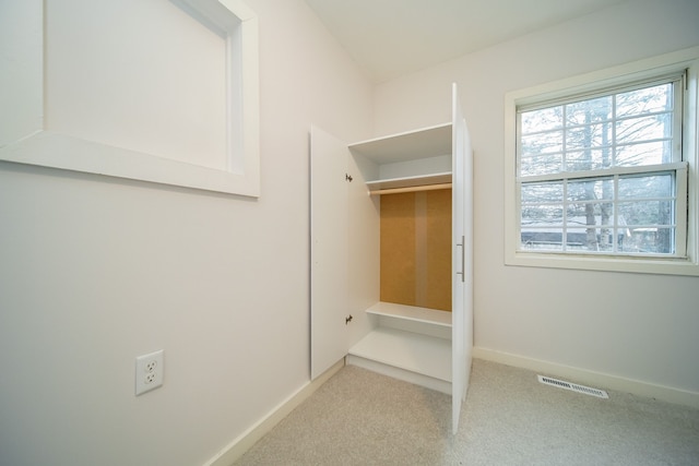 mudroom featuring visible vents, carpet flooring, and baseboards