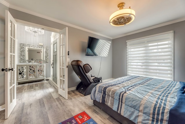 bedroom with wood finished floors, french doors, baseboards, and ornamental molding