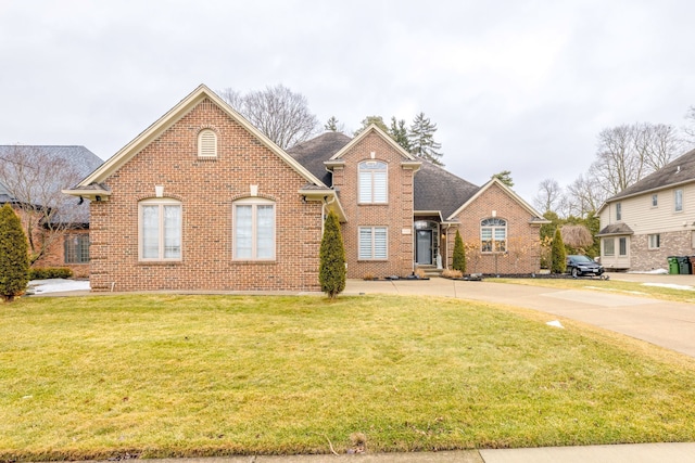 traditional home featuring brick siding and a front lawn