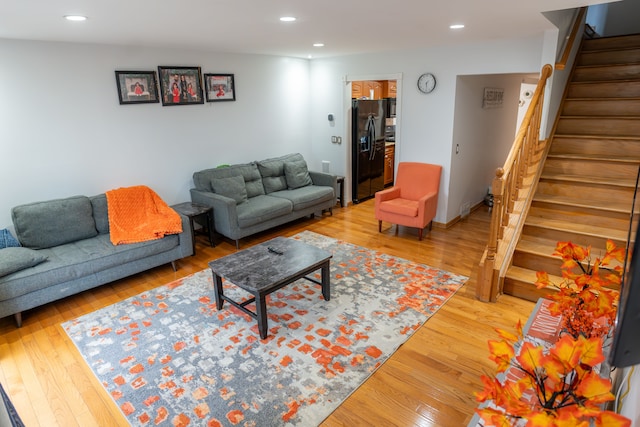 4468 15 Mile Rd Unit 104, Sterling Heights, MI 48310 - living area with recessed lighting, wood finished floors, and stairway
